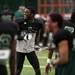 EMU junior defensive back Darius Scott smiles on the field before the spring practice on Sunday, April 14. AnnArbor.com I Daniel Brenner